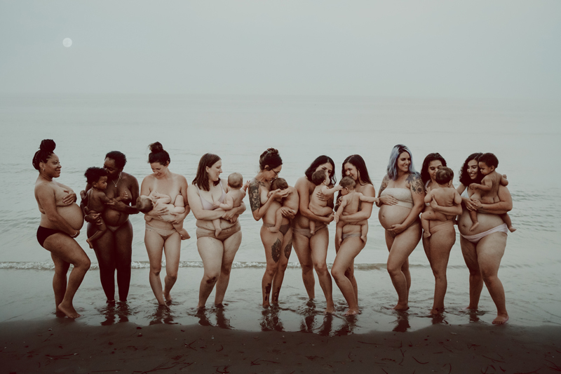 Maternity Photography, groupl of moms holding their babies on the beach